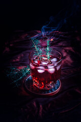 red pomegranate cocktail with ice cubes