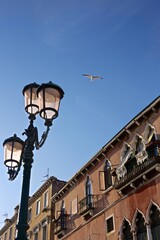 Fototapeta na wymiar street lamp and the view of the blue sky in Venice 