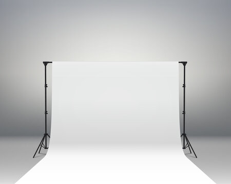 Professional photo studio interior. Photography tripods and racks and paper roll