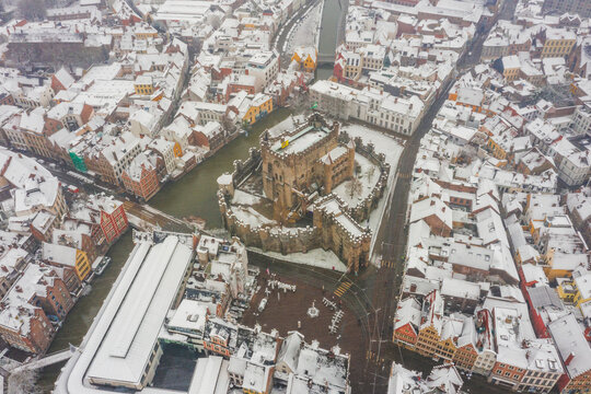 Aerial view of the medieval Castle of the Counts, Gravensteen in wintertime with snow in Ghent, Belgium.