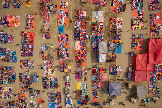 Aerial view of people working and trading at Rahman market along Karnaphuli river, Chittagong, Bangladesh.