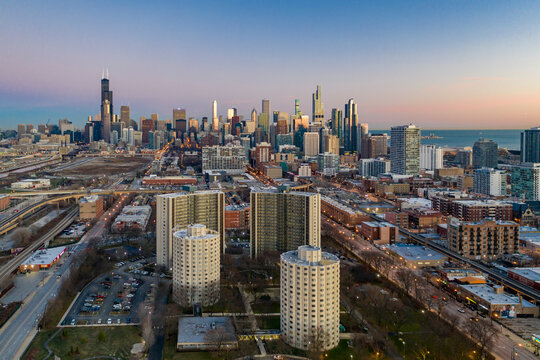 Aerial view of Chicago residential district near Park No. 540 with city skyline in background at sunset, Chicago, Illinois, United States. - Powered by Adobe