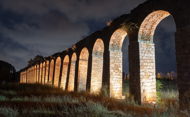Night view of the remains of the 200 year old Ottoman aqueduct, supplied water from Cabri springs to Acco, western Galilee, Israel.