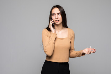 Worried young woman looks nervously, Female is nervous while talking on the phone, feels frustrated...
