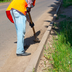 Road cleaning by road workers.