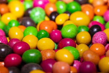 Fototapeta na wymiar Multicolore glazed chocolate candies background