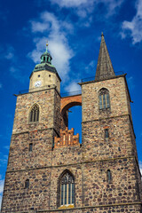 Fototapeta na wymiar Two towers of the Church of St. Nicholas. Juterbog is a historic town in north-eastern Germany, in the district of Brandenburg.