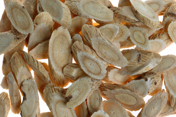 Chinese herbal medicine astragalus membranaceus on a white backg