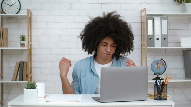 Disappointed College Student Guy Looking At Laptop Failing Exam Indoors