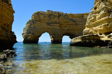Fototapeta na wymiar Rocks on the beach, beach view from Algarve south Portugal. Rock arches. 