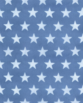 Seamless repeatable pattern of navy blue watercolor background with white hand drawn stars. Stylish texture for design, poster, scrapbook paper, textile, fashion print. Hand painted sketchy drawing.