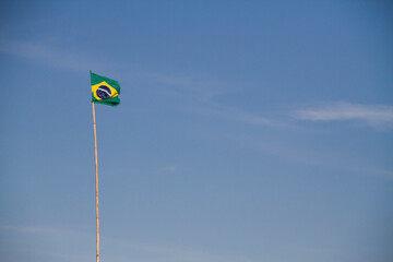 Brazilian flag in a long pole