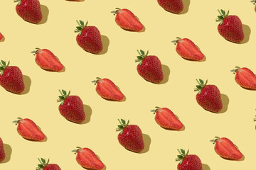 Strawberry pattern on yellow background. Summer fruit concept.