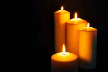 Fototapeta na wymiar Four burning candles
