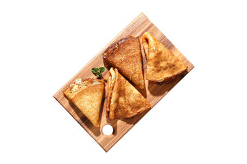Thin pancakes from Russian cuisine. Russian blini, crepes isolated on white background. Shrovetide holiday. Pancake week. Top view.