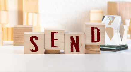 word send spelled in dice, word send on wooden block