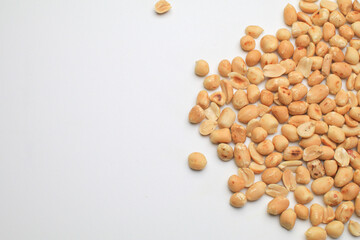 Roasted peanuts isolated on white background, clipping path, full depth of field. Selective focus