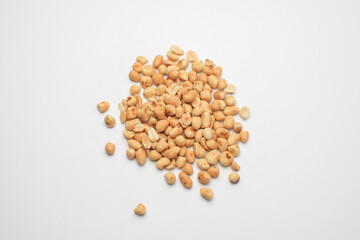 Roasted peanuts isolated on white background, clipping path, full depth of field. Selective focus