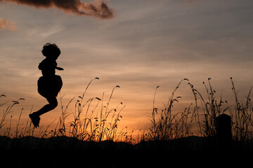Silhouette of Child girl jumping