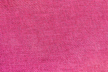 Close-up of red textile texture, red fabric for background and wallpaper.
