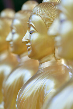 Close-up face of a golden Buddha image