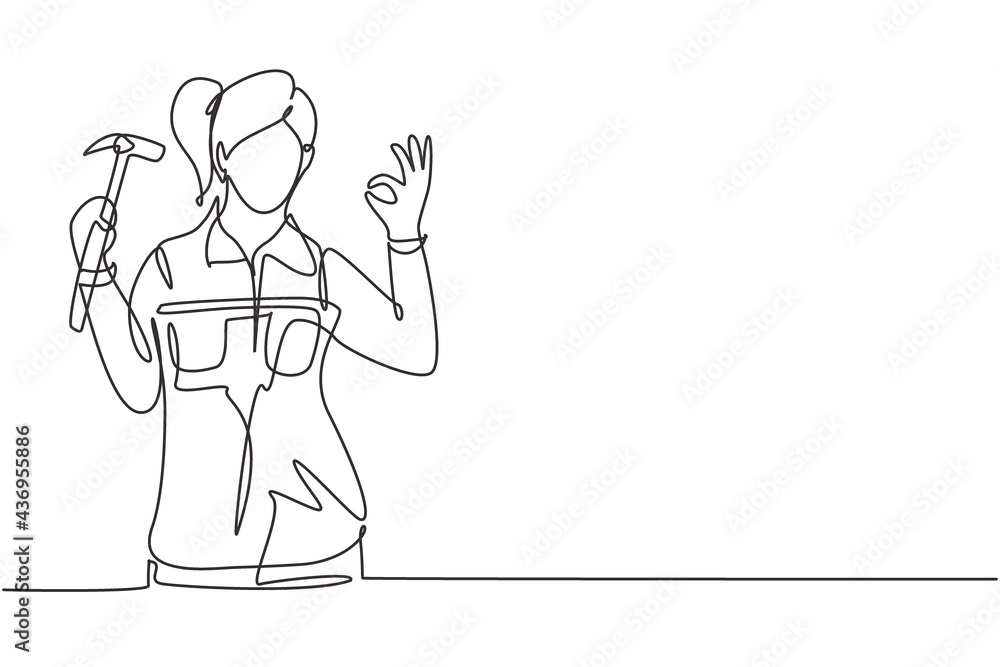 Poster single one line drawing female carpenter with gesture okay works in his workshop making wooden produ