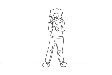 Continuous one line drawing female clown stands with call me gesture wearing wig and clown costume ready to entertain the audience in circus arena. Single line draw design vector graphic illustration