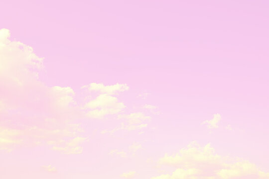 Simple and beautiful pink sky and fluffy clouds background