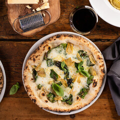 Pizza bianca or white pizza with artichokes and basil