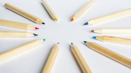 Obraz premium Kid Art education concept. Color pencils on white paper background. copy space