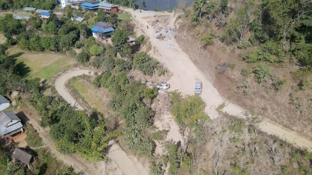 Vehicles are running on the mountain off road in Nepal, aerial drone Nepal 
