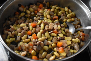 Cooked soy beans with various vegetables in a pot. gomoku nimame. Japanese food.