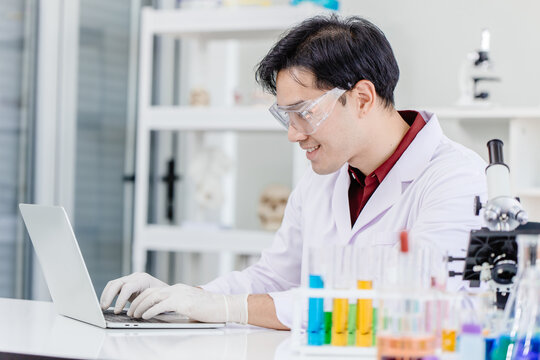 Scientist doctor or Medical laboratory technologist working online in hospital medicine lab with laptop computer happy smile face.