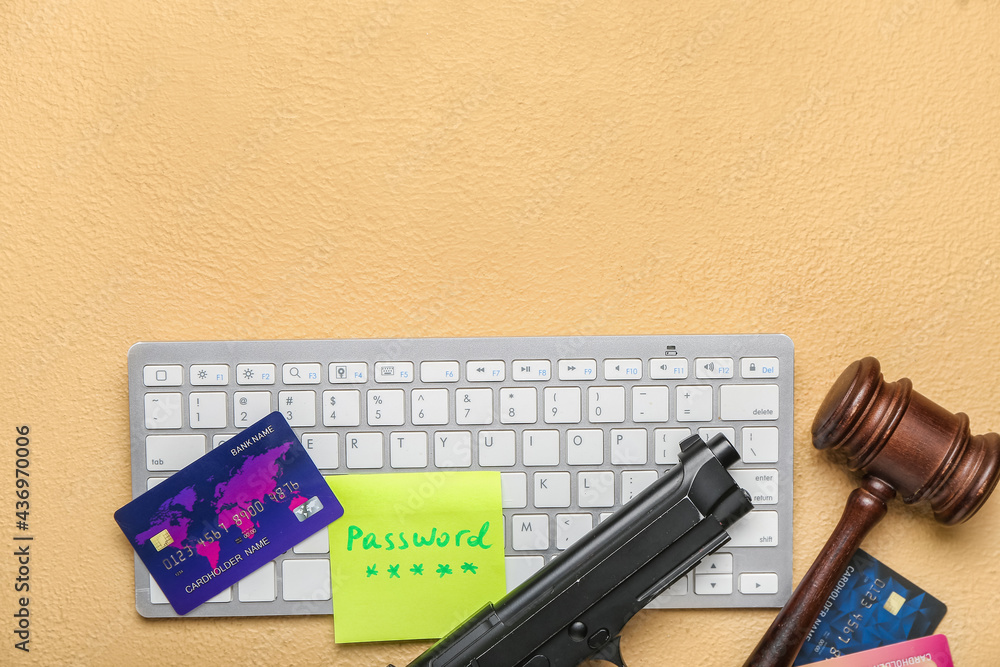 Poster pc keyboard, credit cards, judge gavel and gun on color background. hacking concept