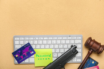 PC keyboard, credit cards, judge gavel and gun on color background. Hacking concept