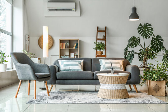 Interior Of Stylish Living Room With Glowing Lamps