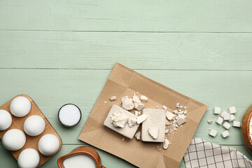 Fresh yeast and ingredients for bakery on color wooden background