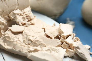 Fresh yeast on color background, closeup
