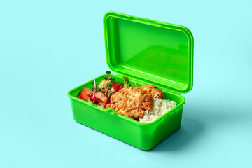 Lunch box with tasty food on color background