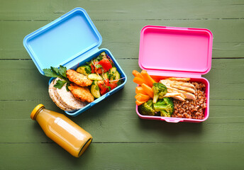 Lunch boxes with tasty food on wooden background