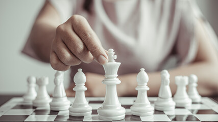 Businesswoman playing chess, Proactive business planning and marketing strategy just like playing...