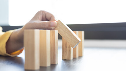 Strategies and risks of wooden games, Close-up of business people gambling with investment risk,...