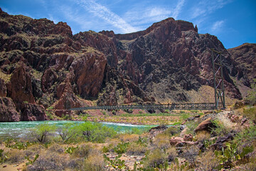 Famous Silver bridge on bright angel trail crossing the colorado river at bottom of grand canyon...