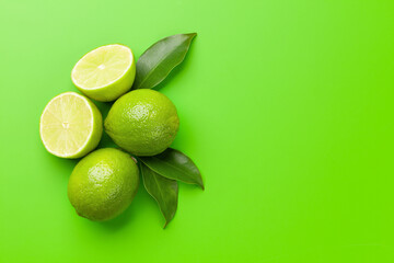 Fresh ripe citrus lime on green background