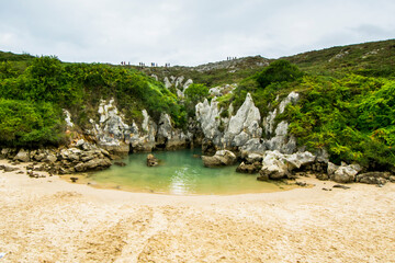 Gulpiyuri beach, in Llanes, an exclusive beach inland from the coast that varies according to the...