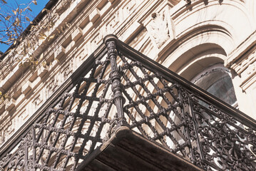 Old Balcony (part of the balcony close-up) made of cast iron with decorative elements.