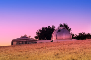 view of an observatory at sunset