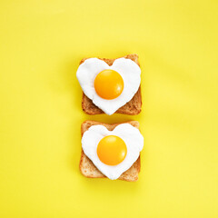 Heart shaped egg in tosted slice of rye bread. Love breakfast design. Healthy sandwich. Festive...