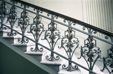 Staircase with handrails and decor in an old building
