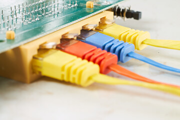 Colorful network cables connected to a green chip board
